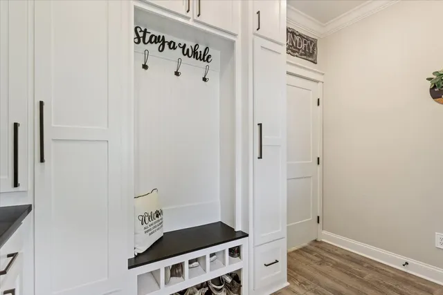 a view of an entryway with wooden floor