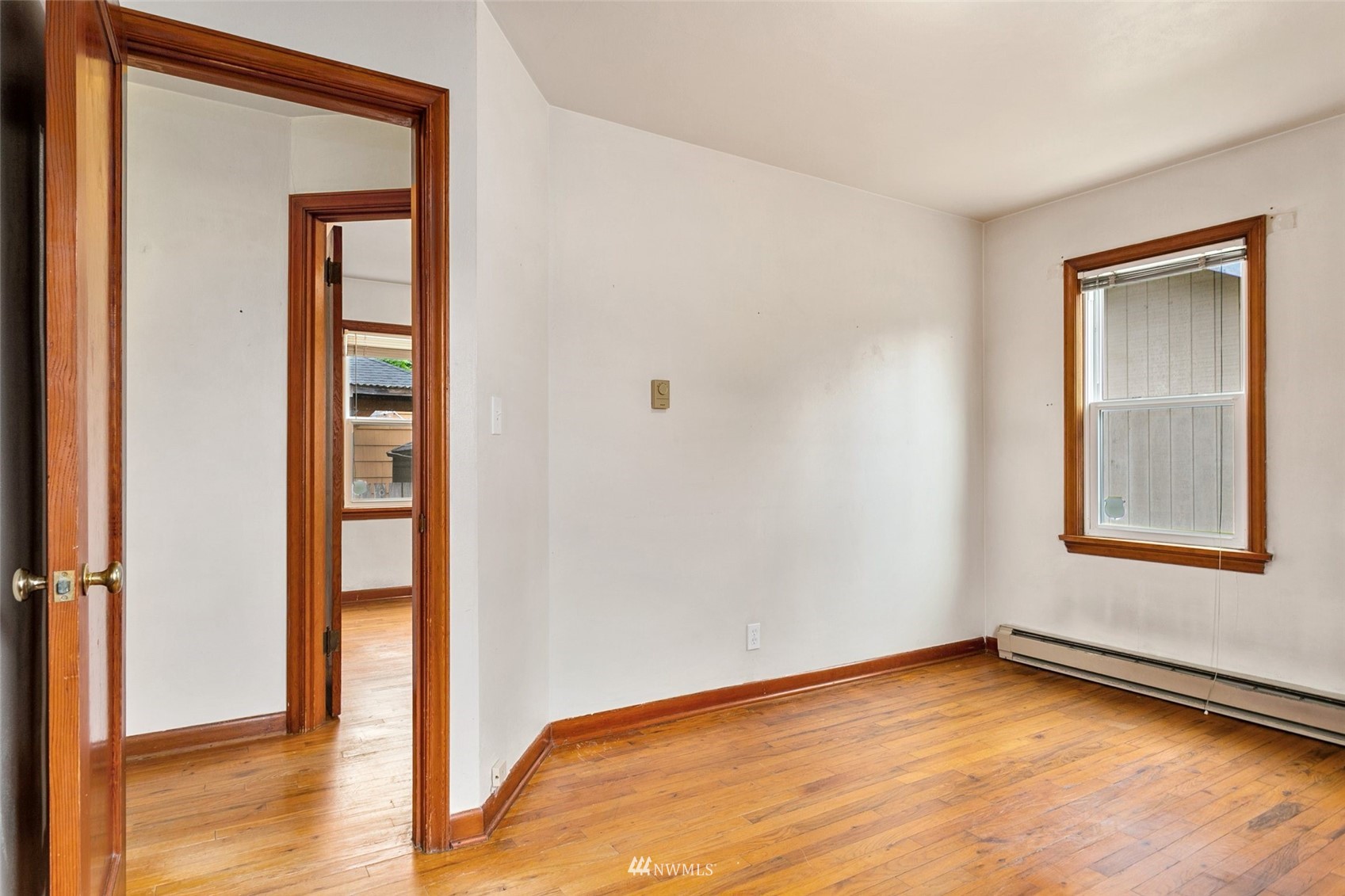 218 West Crow Street Kent, WA 98032 - Photo 16 of 25 a view of an empty room with wooden floor and a window