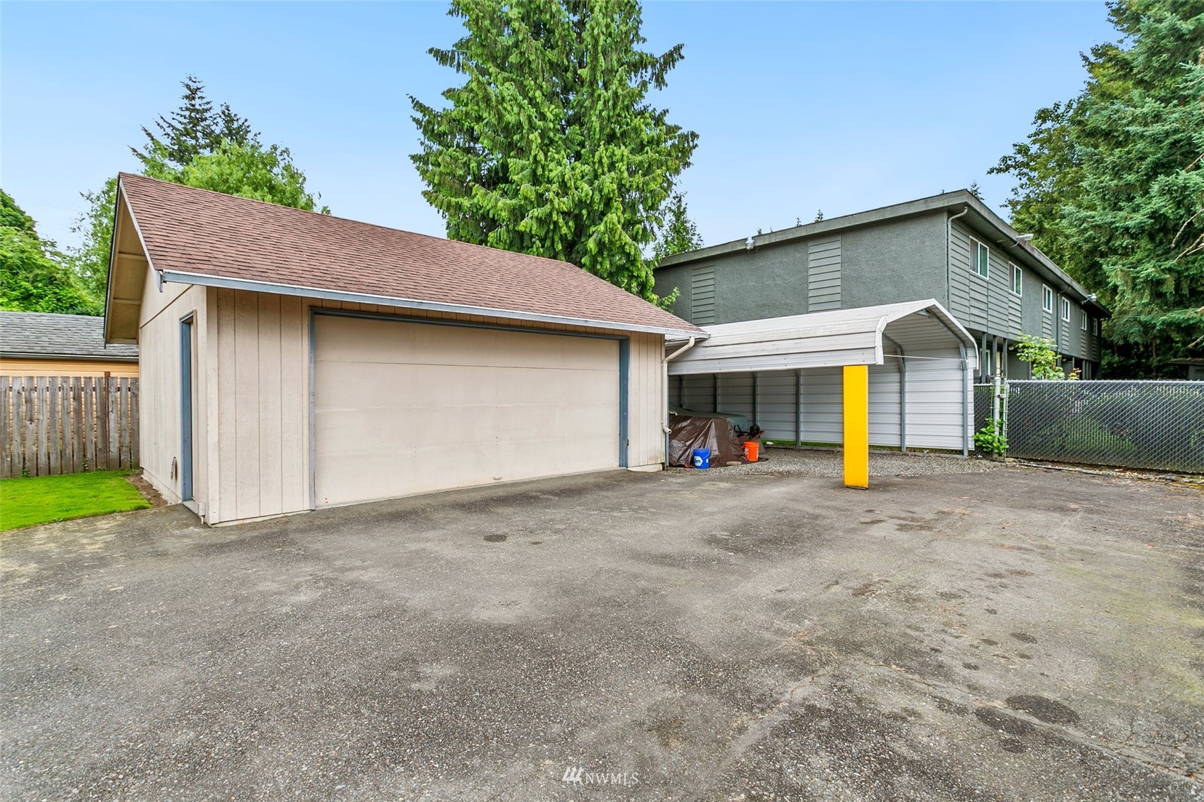 218 West Crow Street Kent, WA 98032 - Photo 22 of 25 a view of a house with a yard and garage