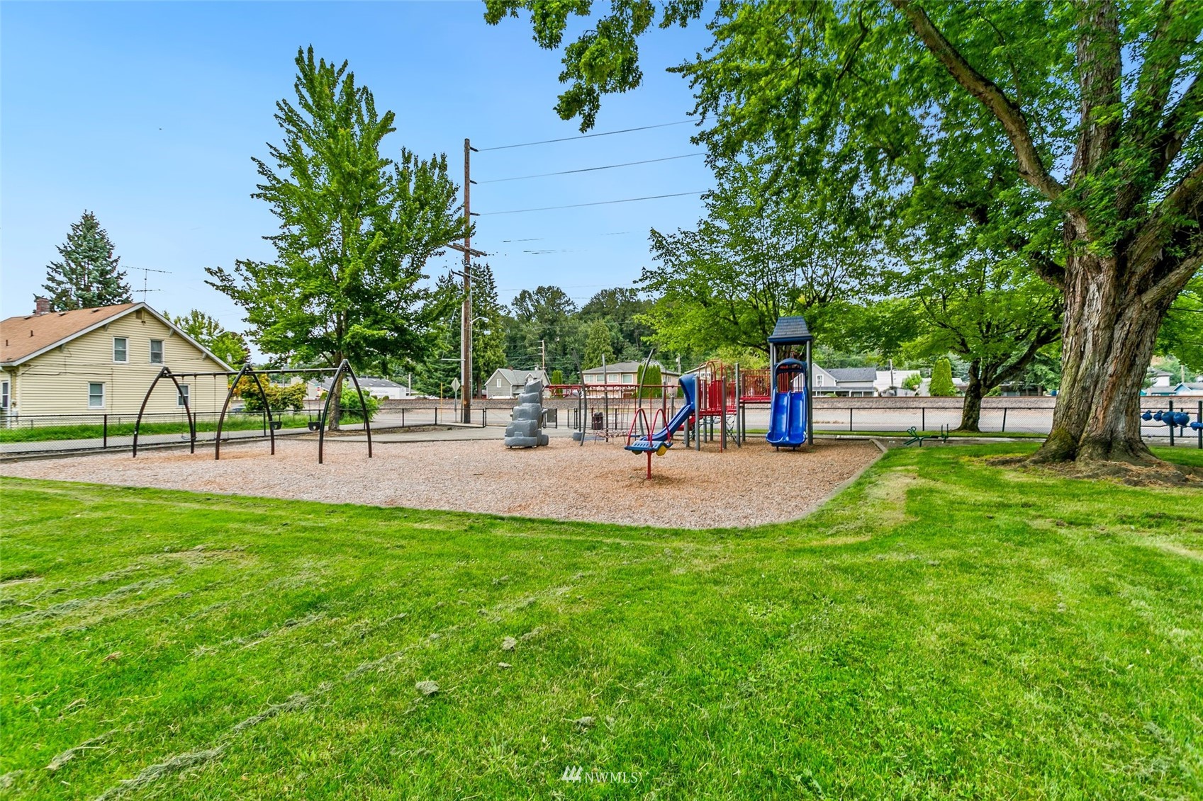 218 West Crow Street Kent, WA 98032 - Photo 23 of 25 a view of a park with swings and slides