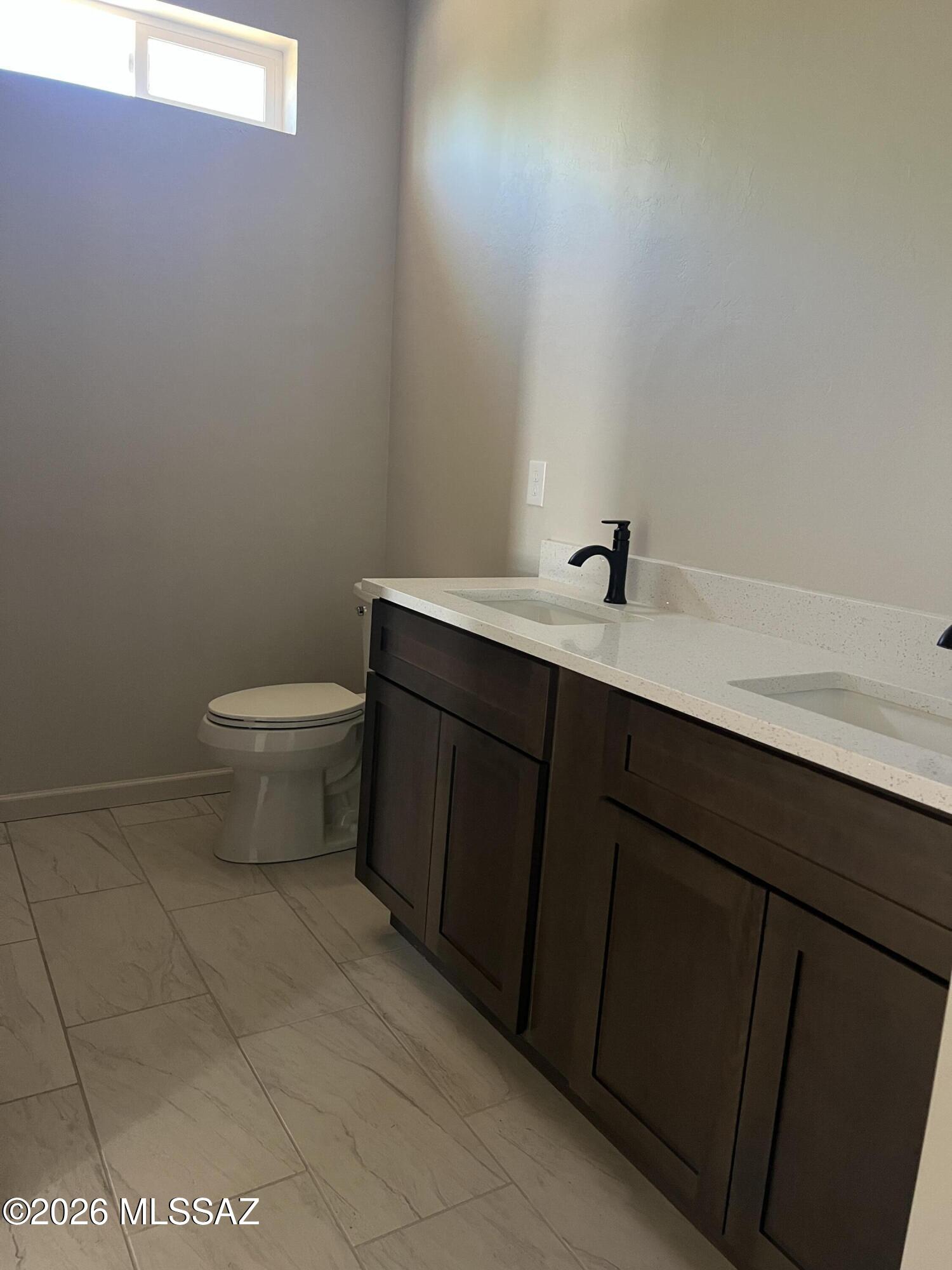 1501 Circulo Sombrero Rio Rico, AZ 85648 - Photo 18 of 26 a bathroom with a sink and a toilet