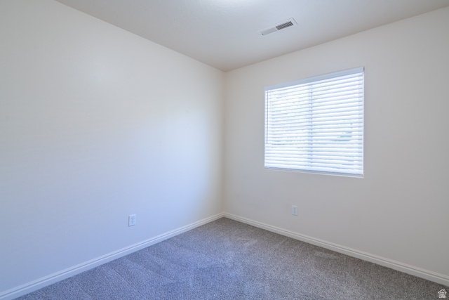 1735 West 540 North, Unit 1805 St. George, UT 84770 - Photo 56 of 64 Carpeted room featuring a single window with horizontal blinds, white walls, and white baseboards