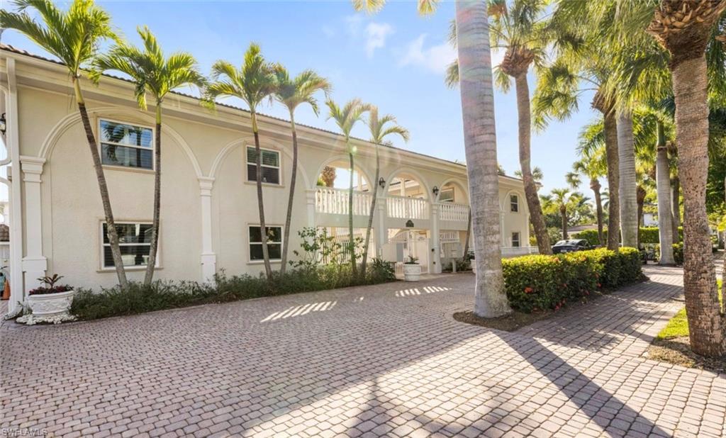 980 7th Avenue South, Unit 204 Naples, FL 34102 - Photo 15 of 18 a view of a two chairs in the patio