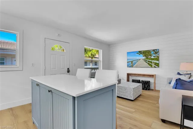 a room with furniture and painting on the wall