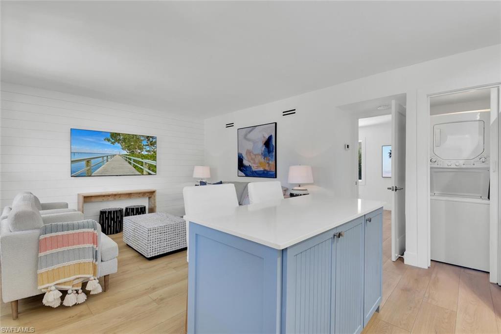 980 7th Avenue South, Unit 204 Naples, FL 34102 - Photo 5 of 18 a living room with furniture and a table