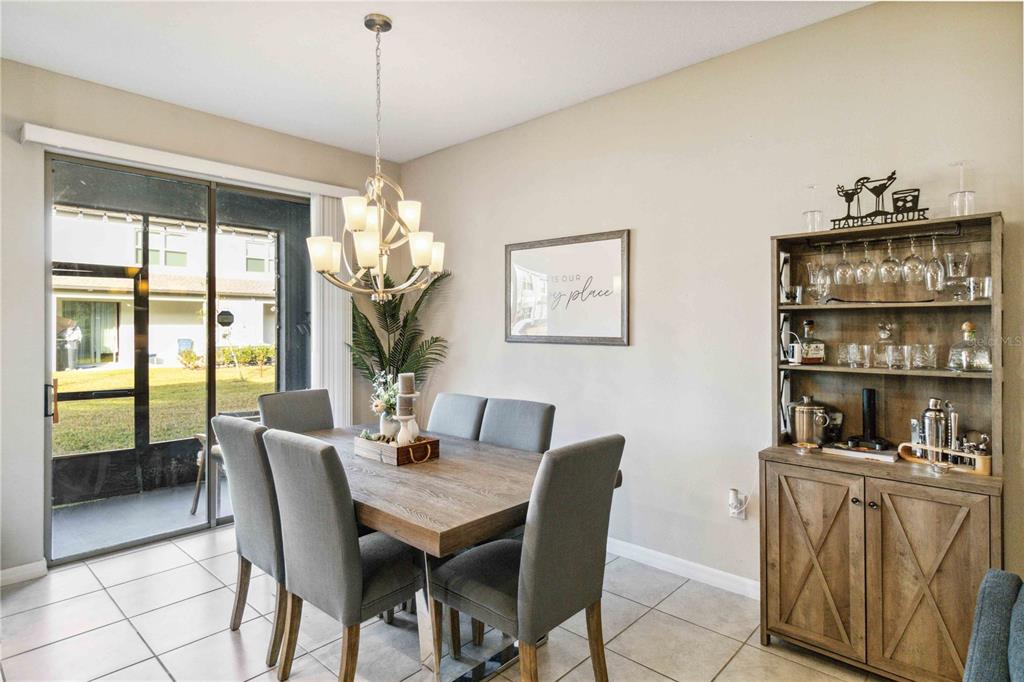 14339 Easy Goer Street Ruskin, FL 33573 - Photo 12 of 49 a view of a dining room with furniture window and outside view