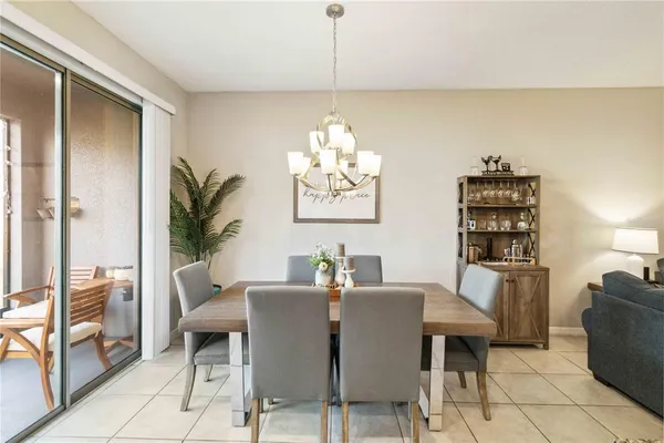 a dining room with furniture and window