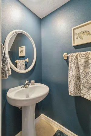 a bathroom with a sink and mirror