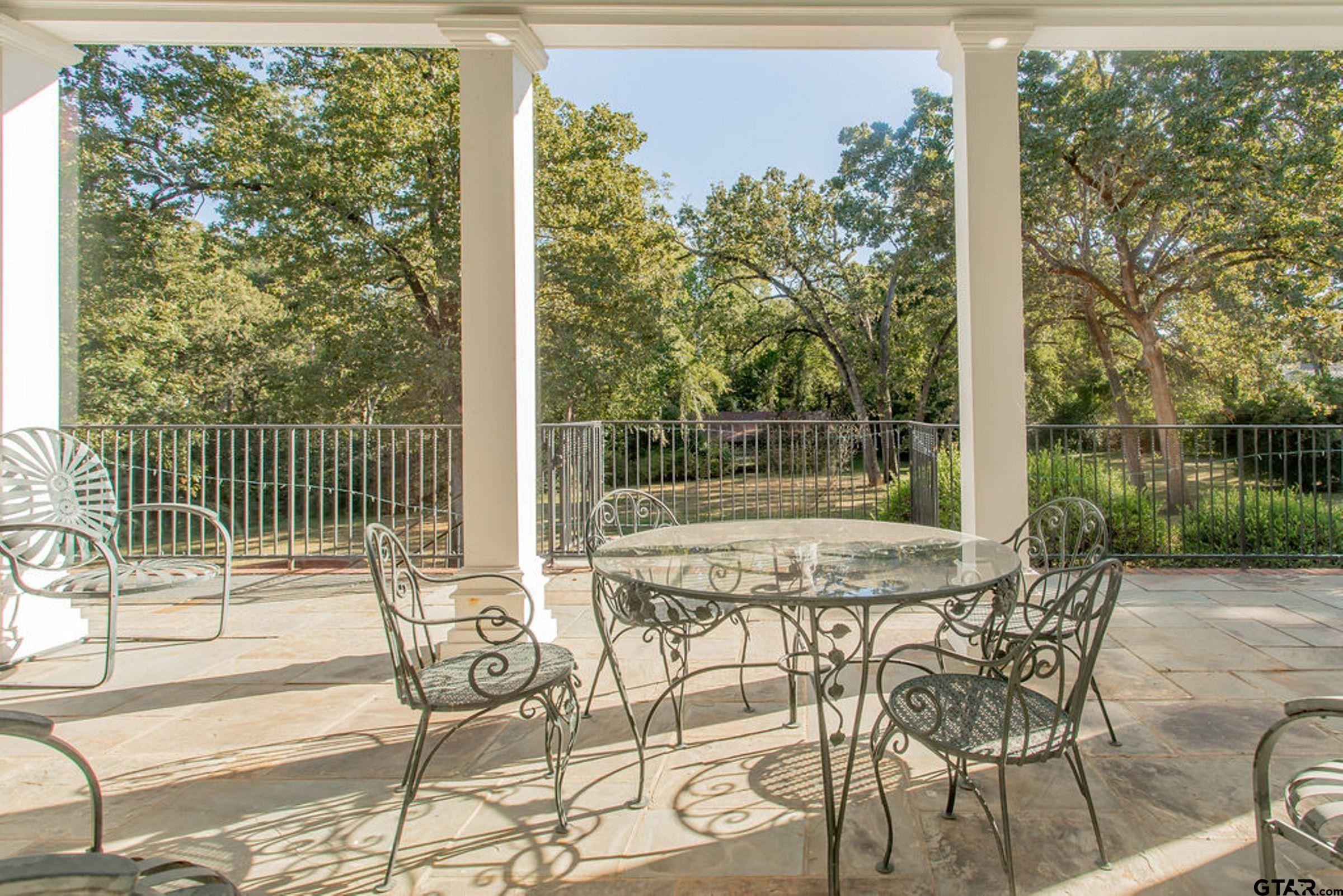 408 East Jolly Street Palestine, TX 75801 - Photo 18 of 48 a view of a patio with a table and chairs