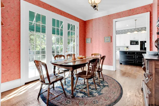 a kitchen with a sink dishwasher a stove and a microwave oven with cabinets