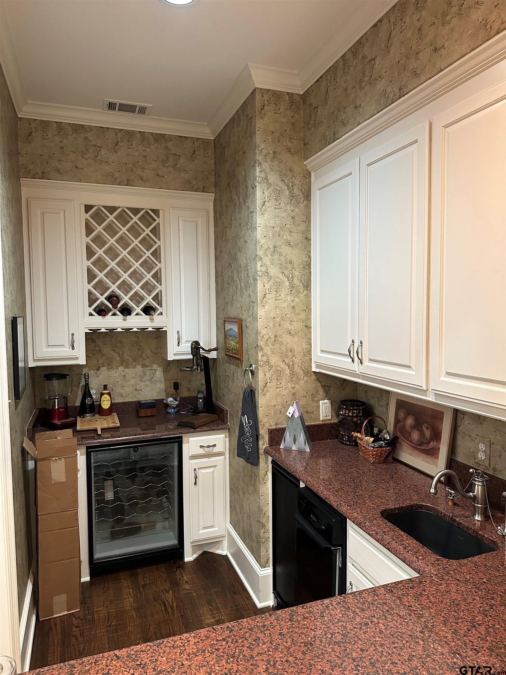 408 East Jolly Street Palestine, TX 75801 - Photo 23 of 48 a kitchen with granite countertop a sink a stove and cabinets