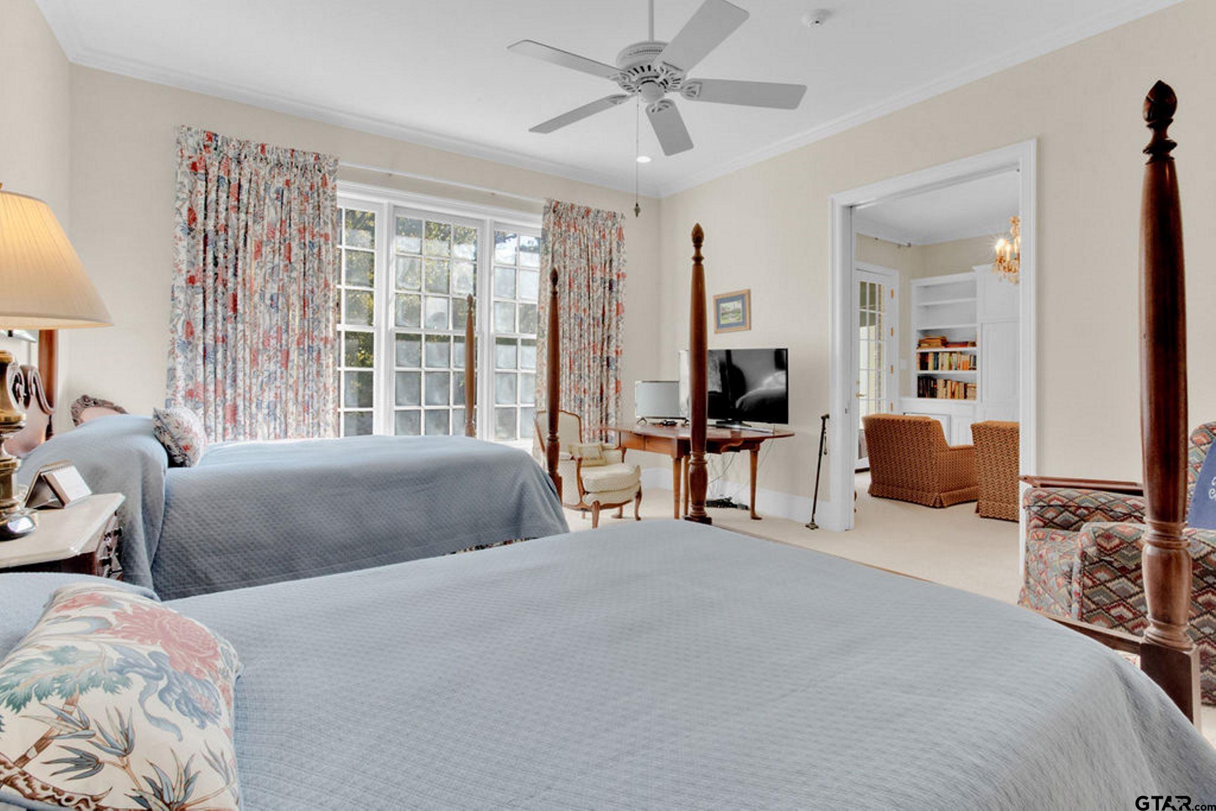 408 East Jolly Street Palestine, TX 75801 - Photo 27 of 48 a bedroom with two beds and a large mirror