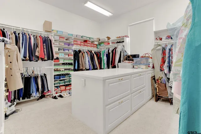 a view of a livingroom with furniture and stairs