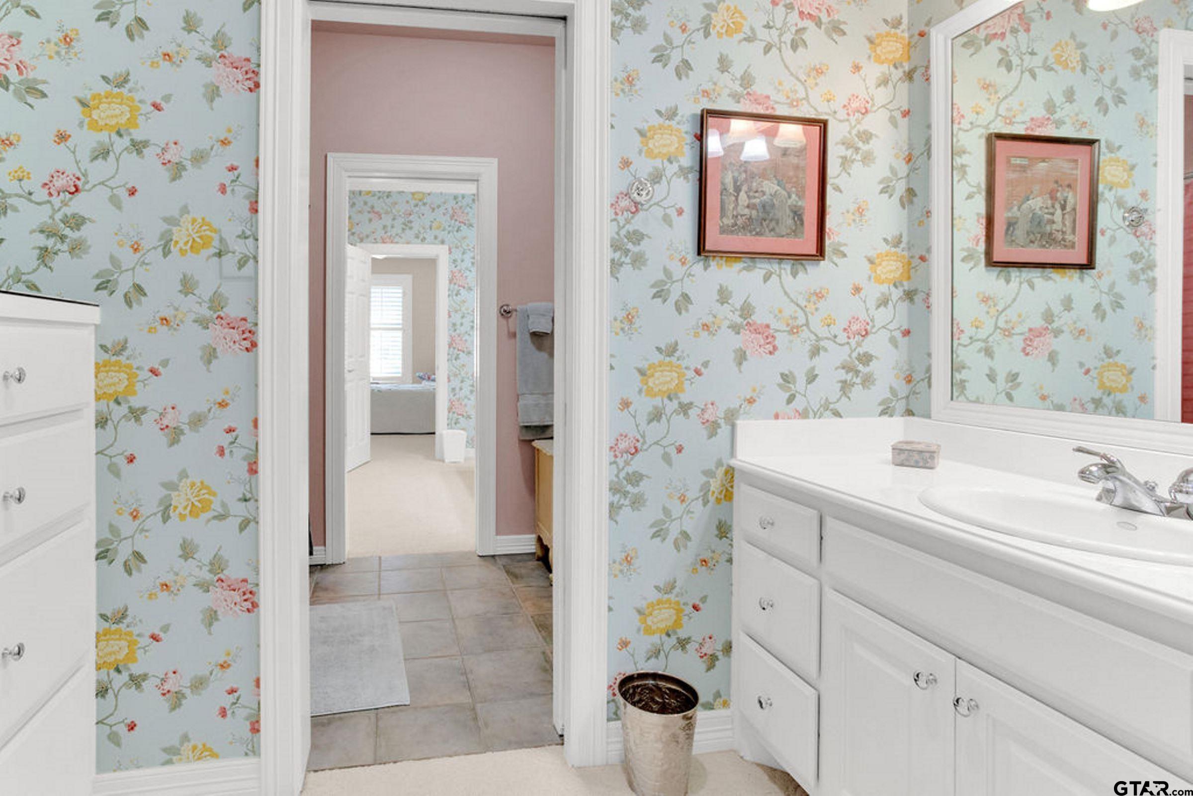408 East Jolly Street Palestine, TX 75801 - Photo 37 of 48 a bathroom with a sink and a mirror