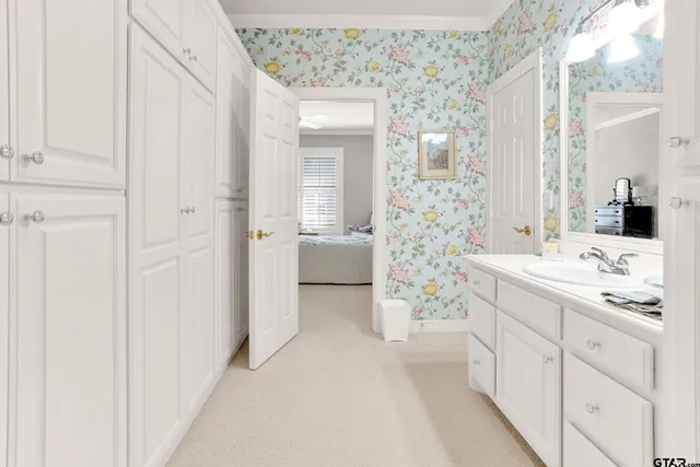 a bedroom with bed and window