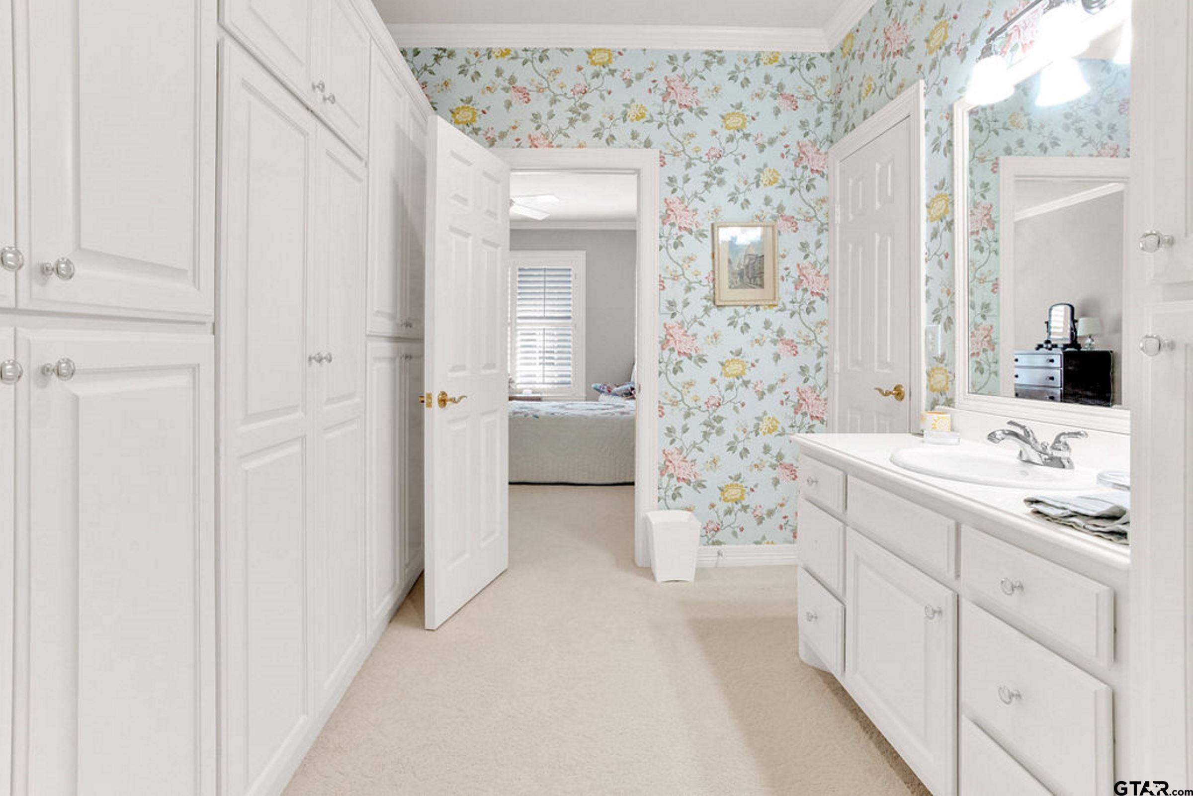 408 East Jolly Street Palestine, TX 75801 - Photo 38 of 48 a en suite bathroom with a double vanity sink and mirror