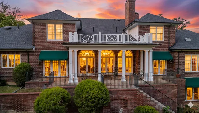 front view of a building with a garden