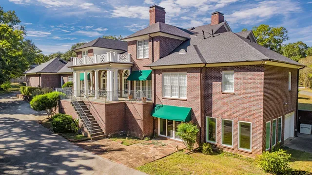 a view of a yard with large trees