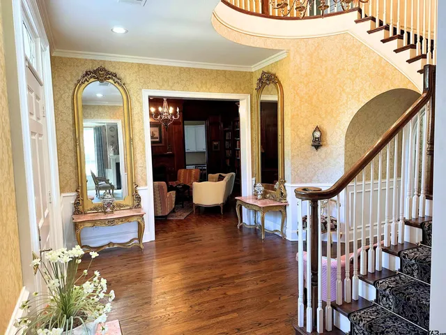 a view of a living room and dining room