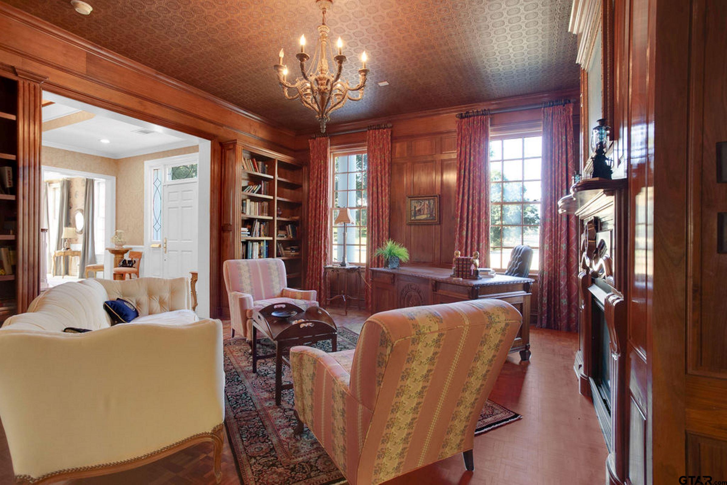 408 East Jolly Street Palestine, TX 75801 - Photo 8 of 48 a living room with furniture a chandelier and a chandelier