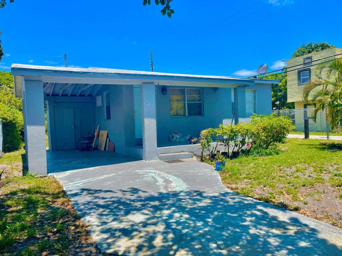 611 35th Street West Palm Beach, FL 33407 - Photo 2 of 9 a view of a house with a porch