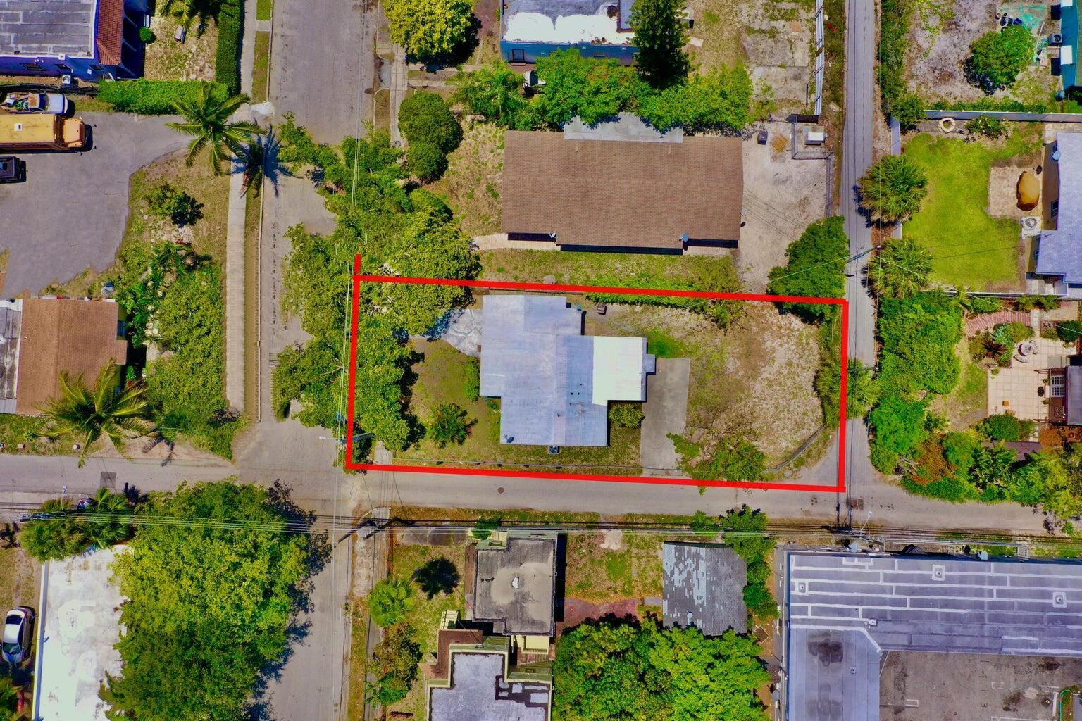 611 35th Street West Palm Beach, FL 33407 - Photo 8 of 9 an aerial view of a house with a yard and garden