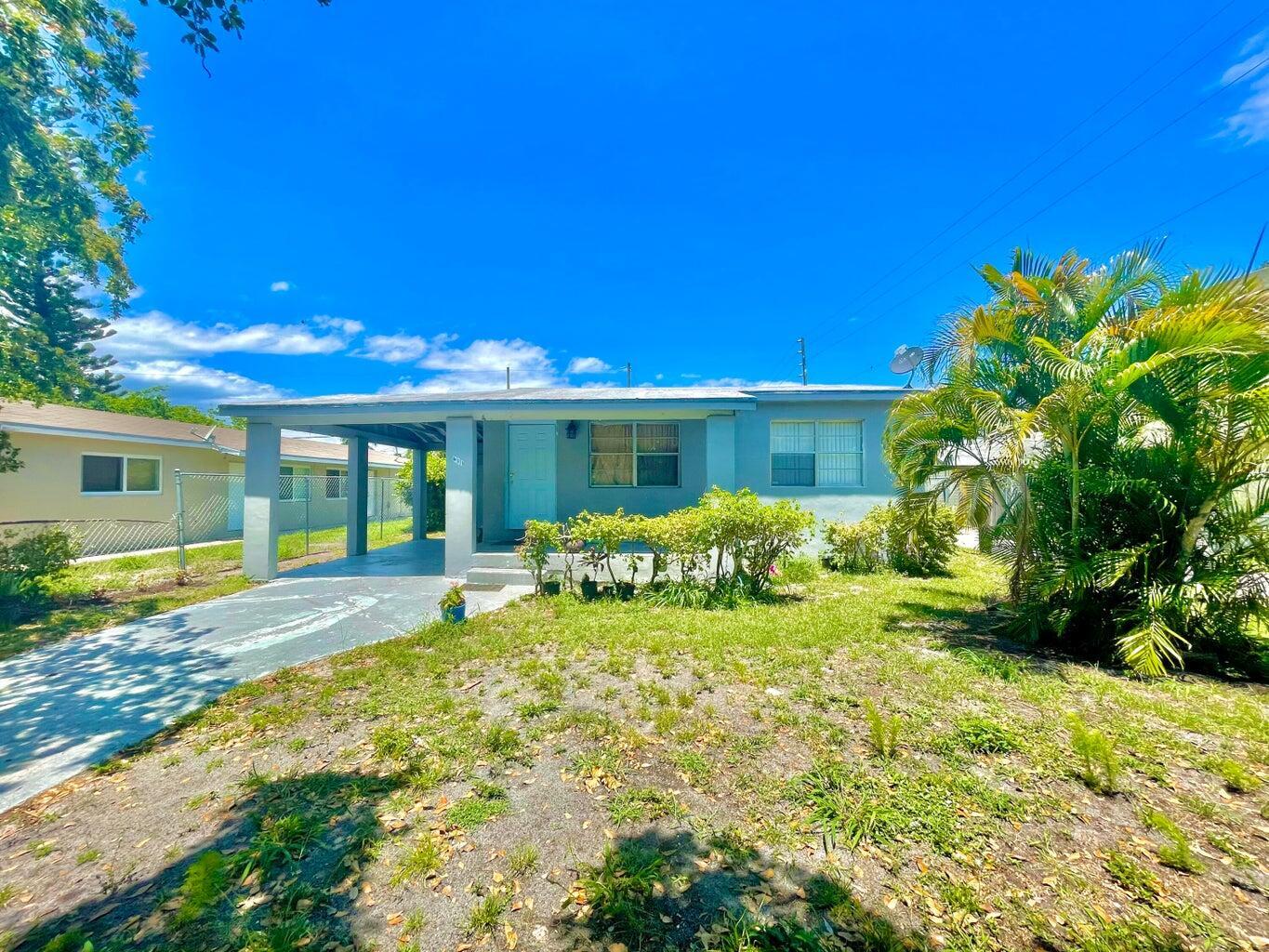 611 35th Street West Palm Beach, FL 33407 - Photo 9 of 9 a view of a house with backyard and sitting area