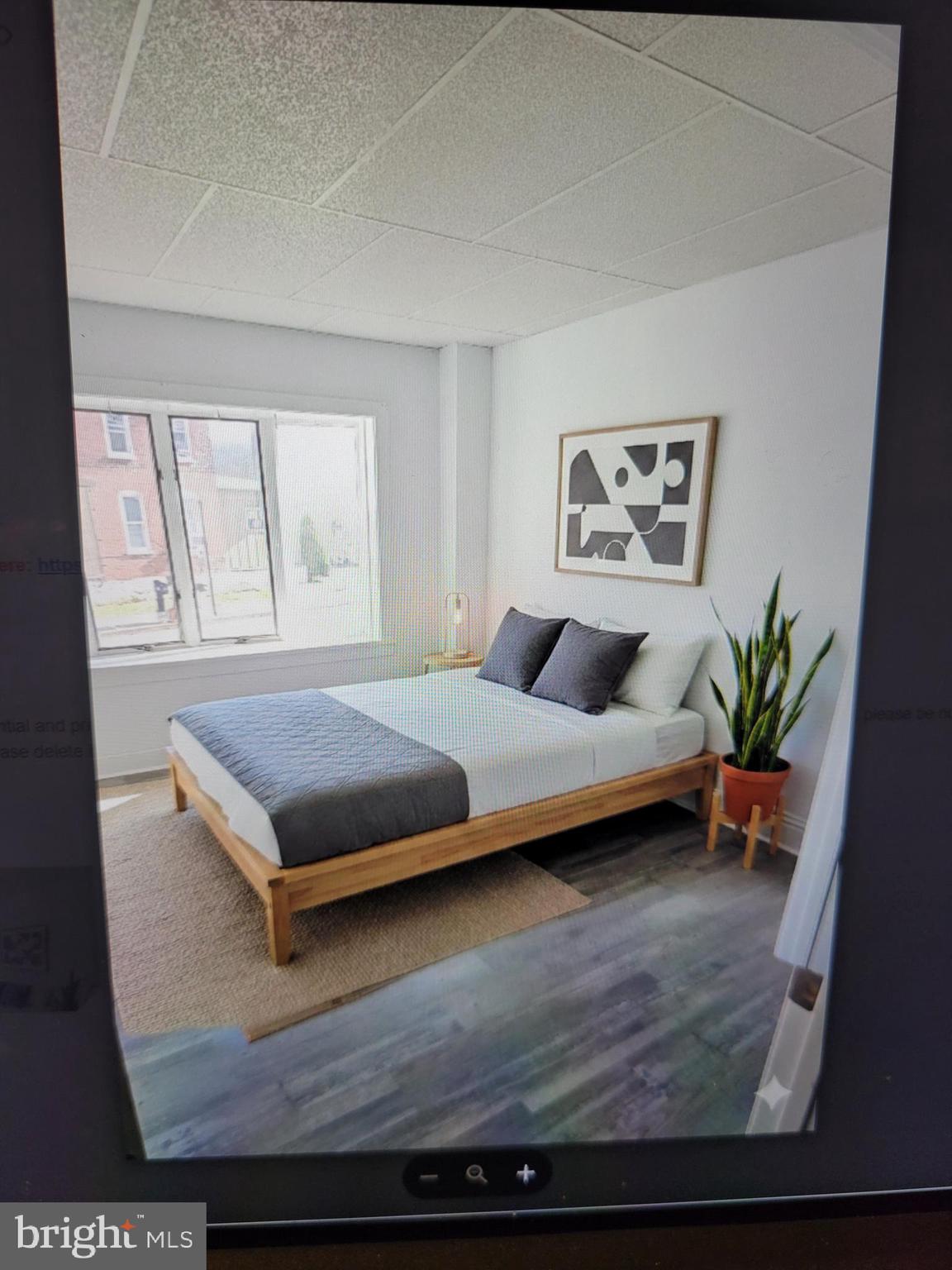1801 South Main Street, Unit 6 Bechtelsville, PA 19505 - Photo 13 of 20 a bedroom with a bed and wooden floor