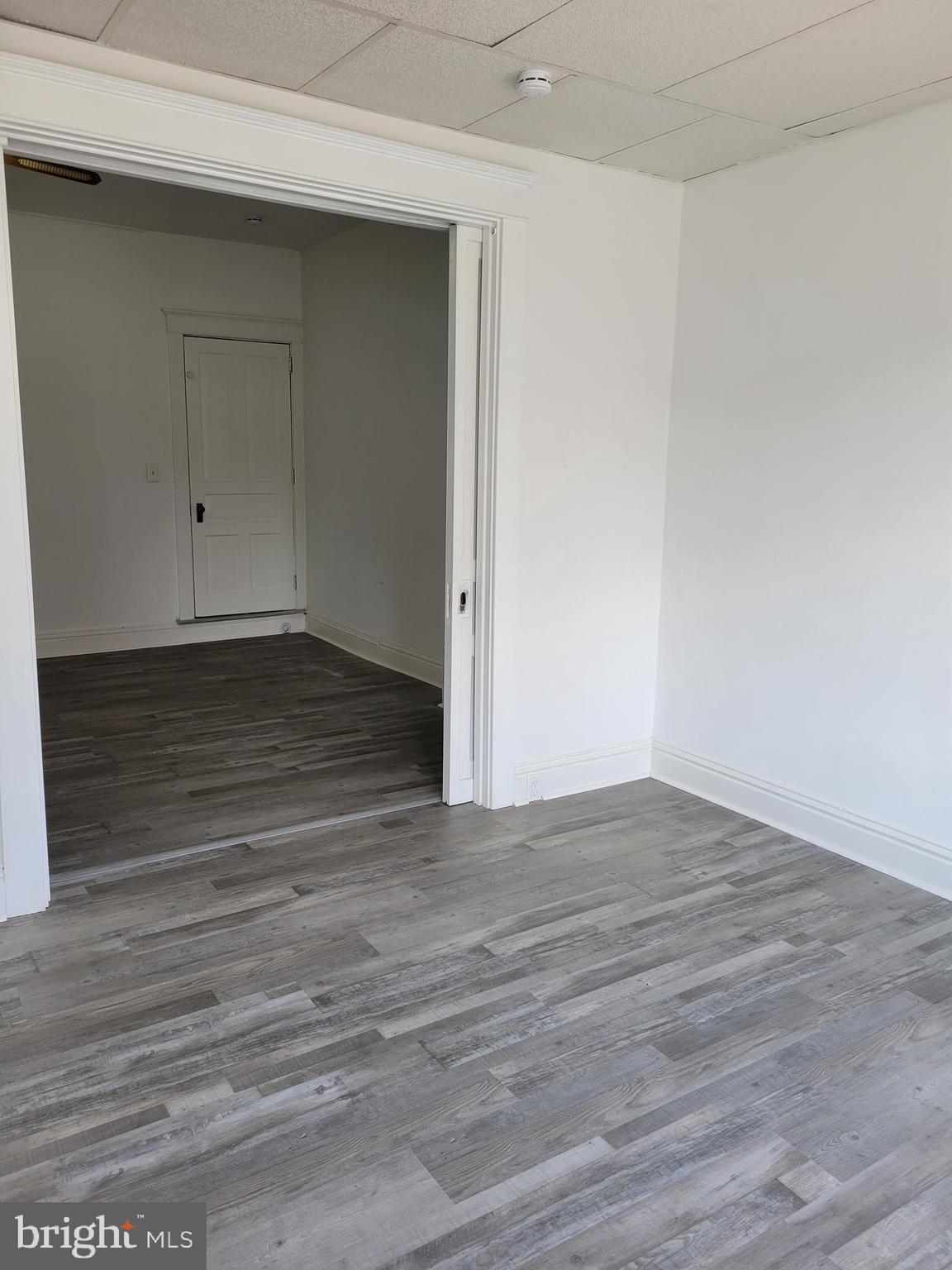 1801 South Main Street, Unit 6 Bechtelsville, PA 19505 - Photo 15 of 20 a view of an empty room with wooden floor