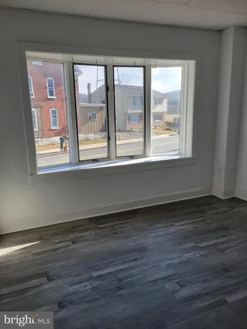 a bathroom with a toilet and a bathtub