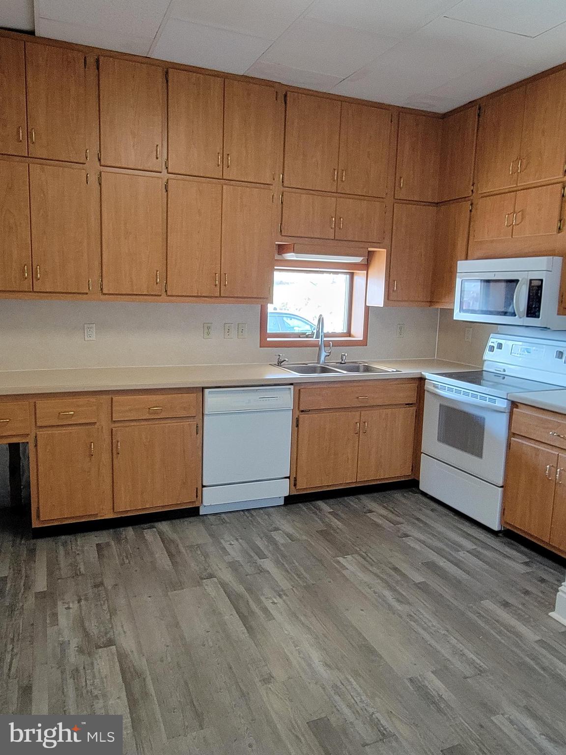 1801 South Main Street, Unit 6 Bechtelsville, PA 19505 - Photo 2 of 20 a view of a kitchen with furniture and wooden floor