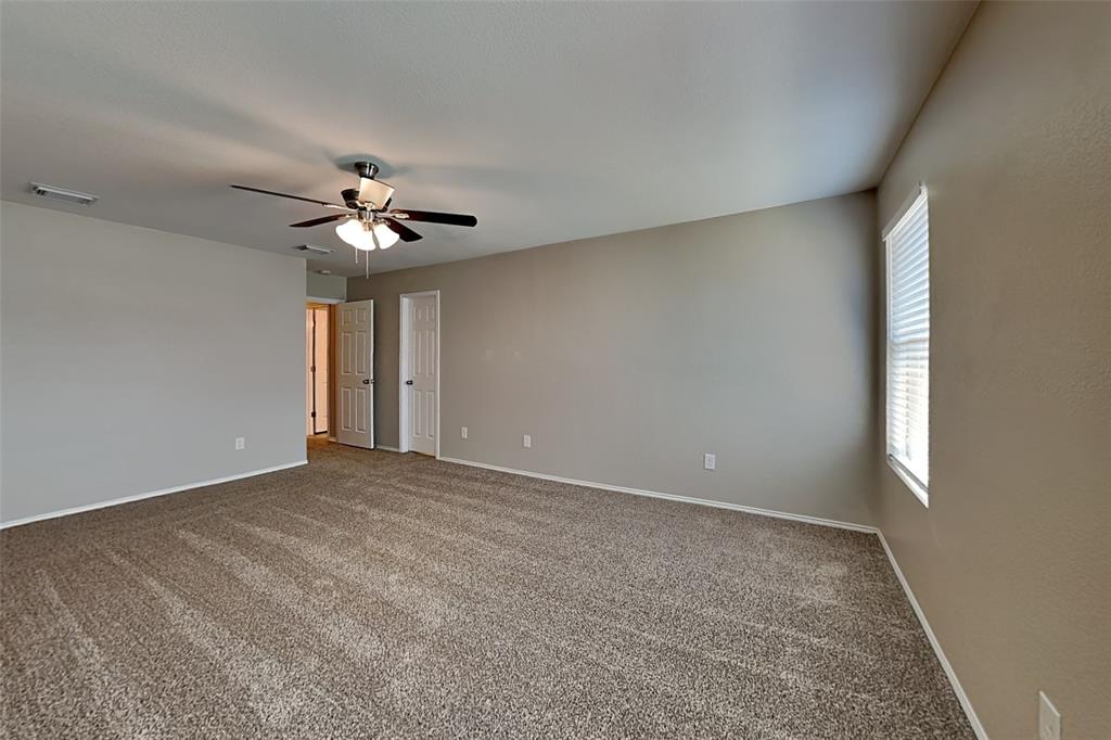 1420 Waterford Drive Little Elm, TX 75068 - Photo 11 of 23 a view of an empty room with a window