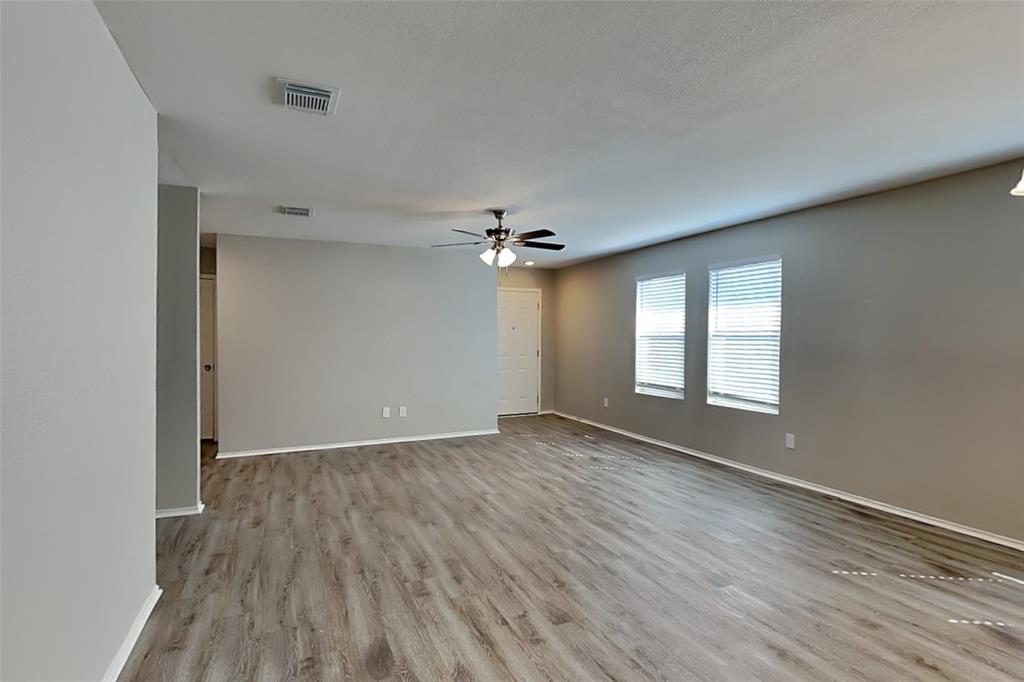 1420 Waterford Drive Little Elm, TX 75068 - Photo 2 of 23 wooden floor in an empty room with a window