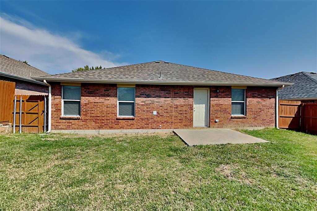 1420 Waterford Drive Little Elm, TX 75068 - Photo 22 of 23 a front view of a house with garden