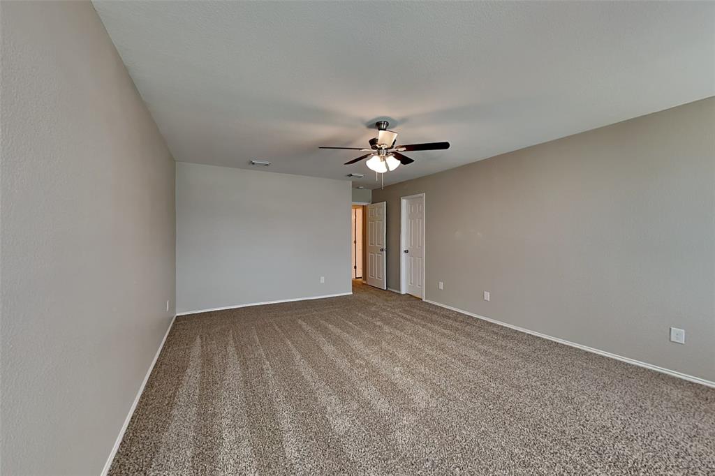 1420 Waterford Drive Little Elm, TX 75068 - Photo 10 of 23 a view of an empty room with a chandelier fan