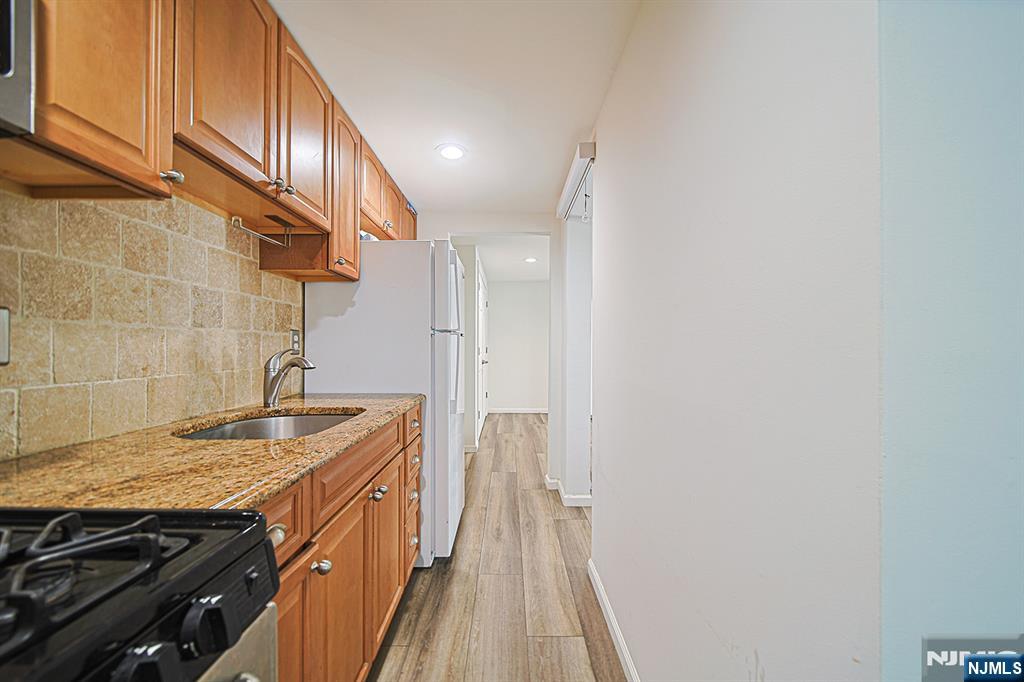 897 Virgil Avenue Ridgefield, NJ 07657 - Photo 46 of 50 a bathroom with a sink and a granite counter tops