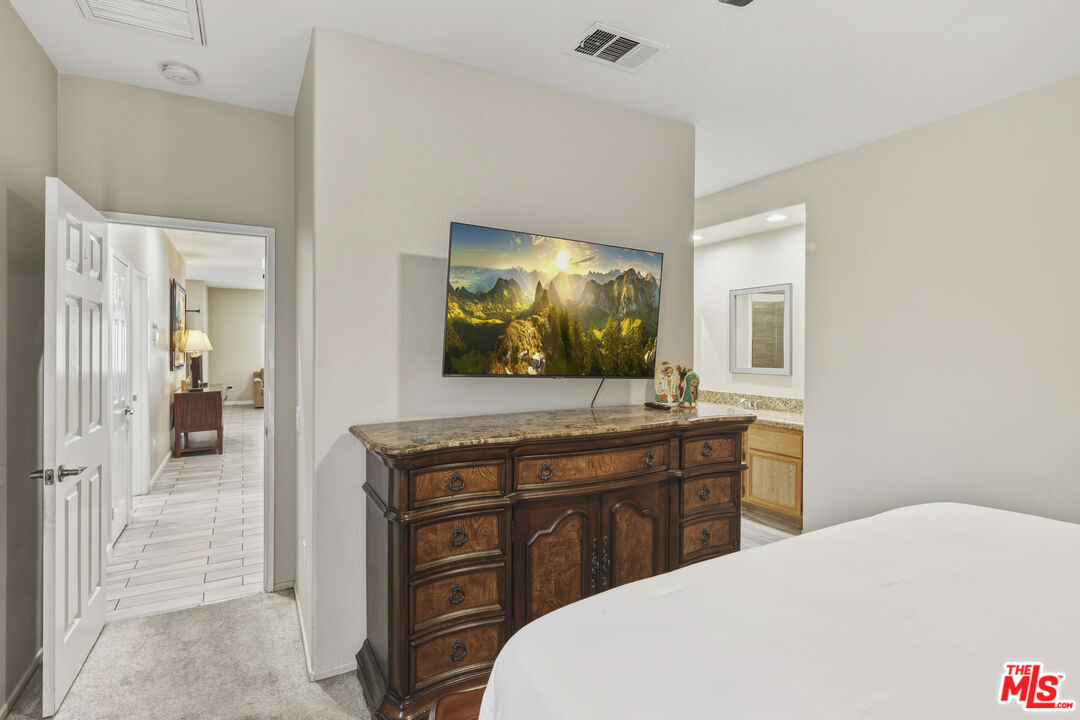 47395 Monroe Street, Unit 254 Indio, CA 92201 - Photo 12 of 21 a room with a sink and a mirror