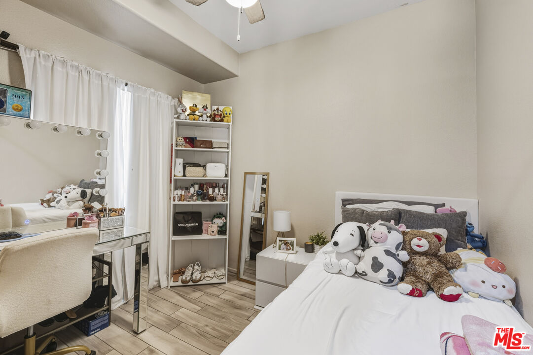 47395 Monroe Street, Unit 254 Indio, CA 92201 - Photo 16 of 21 a bedroom with a bed and a window