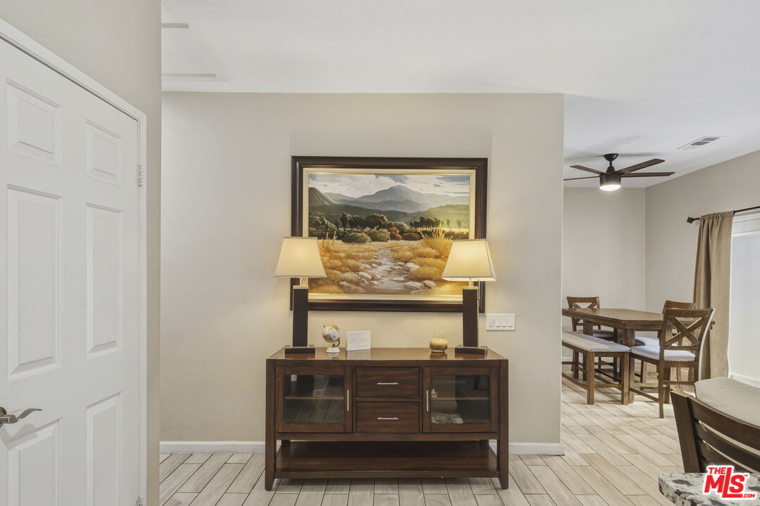 47395 Monroe Street, Unit 254 Indio, CA 92201 - Photo 4 of 21 a living room with furniture and a wooden floor