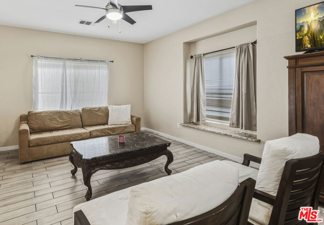 47395 Monroe Street, Unit 254 Indio, CA 92201 - Photo 5 of 21 a living room with furniture and a window