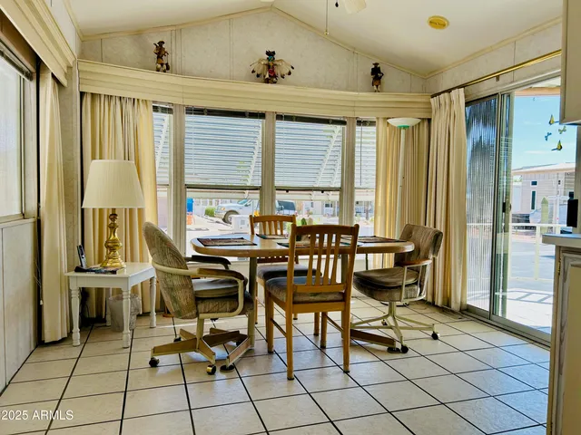 a view of a livingroom with furniture and window