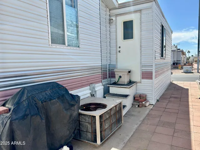 a view of a white house with many windows