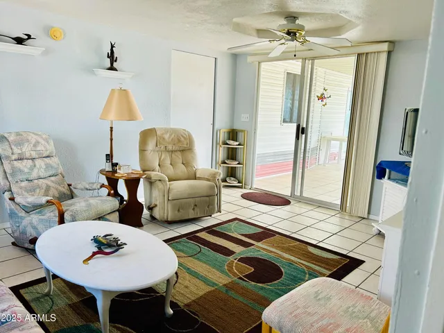 a living room with furniture and a table