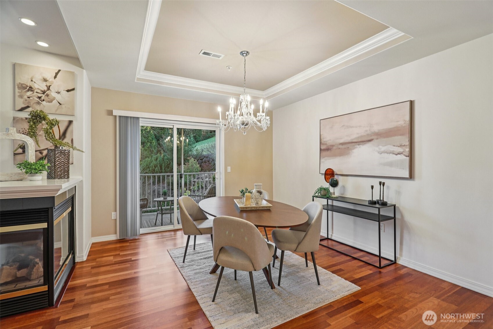 4406 Providence Point Place Southeast, Unit 301 Issaquah, WA 98029 - Photo 5 of 26 a dining room with wooden floor a chandelier a wooden table and chairs