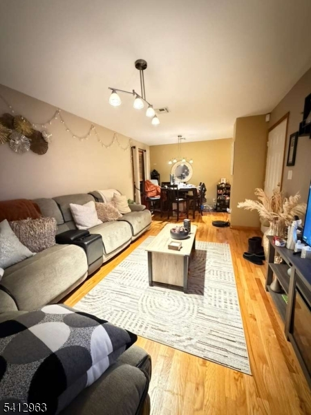 328 High Street, Unit 2 Elizabeth, NJ 07202 - Photo 3 of 13 a living room with furniture and wooden floor