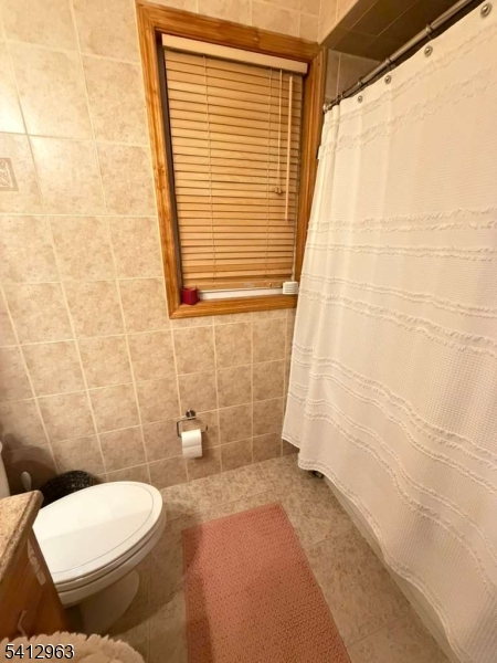 328 High Street, Unit 2 Elizabeth, NJ 07202 - Photo 10 of 13 a bathroom with a toilet and a shower