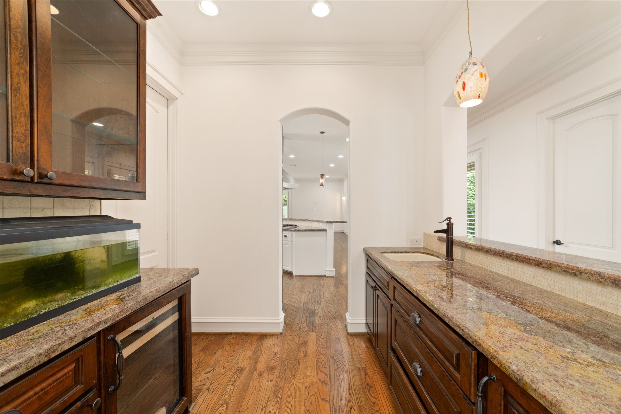 4102 Gramercy Street Houston, TX 77025 - Photo 15 of 35 a kitchen with granite countertop a sink cabinets and stainless steel appliances