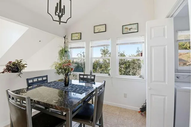 a bathroom with a granite countertop sink toilet and a mirror