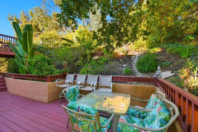 a view of balcony with furniture and wooden deck