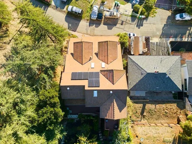 an aerial view of residential houses with outdoor space